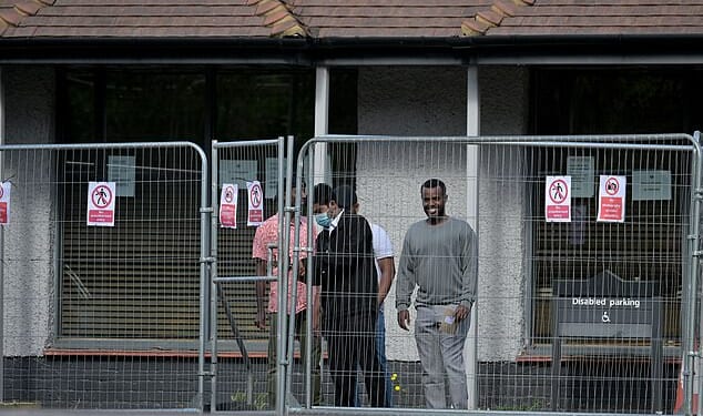 Migrants housed at Epping's The Bell Hotel, pictured this month. Asylum seekers housed in hotels are having babies because they think it will boost their chances of gaining a British passport, a BBC documentary has revealed