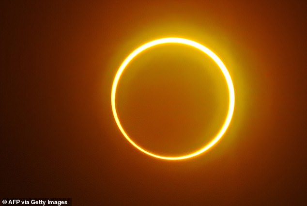 There will be a partial solar eclipse, when the moon block part of the sun, starting at 1:29pm ET on Sunday, September 21 (Stock Image)