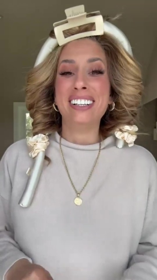 Stacey Solomon wearing a heatless hair curler set and hair clips.