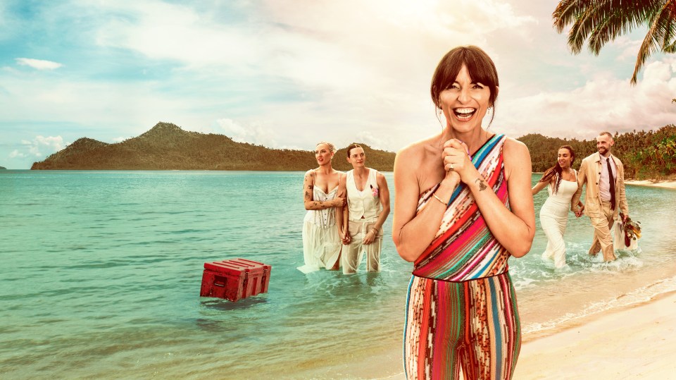 A woman joyfully watches as three couples wade ashore on a tropical beach.