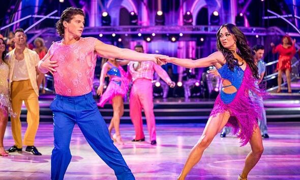 A male and female dancer performing on Strictly Come Dancing.