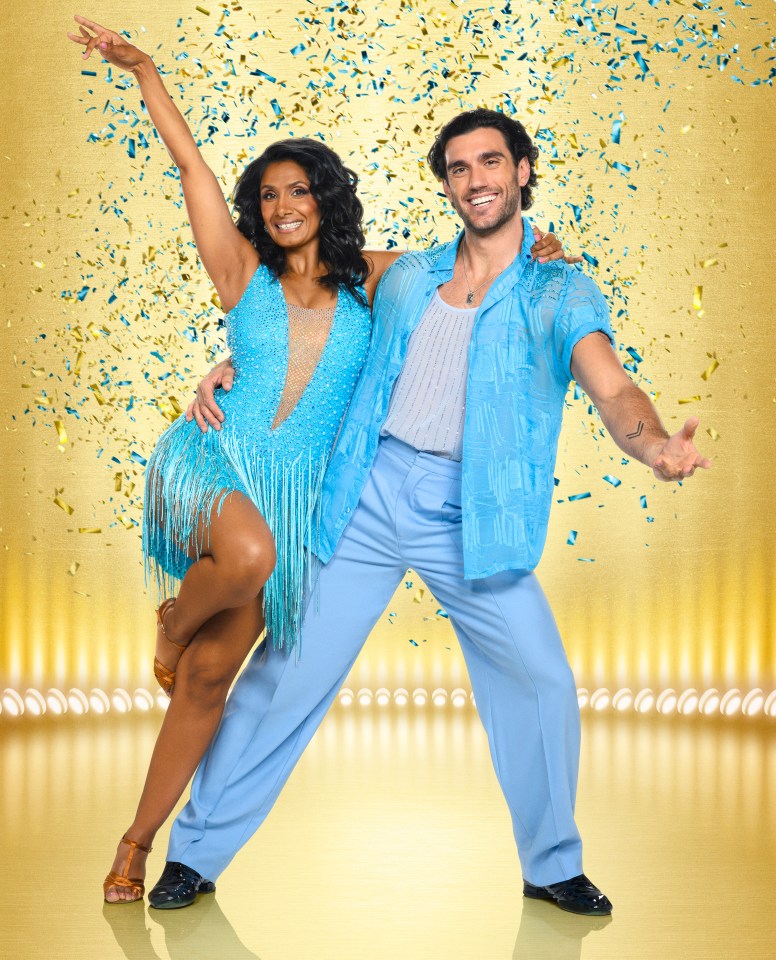 Balvinder Sopal and Julian Caillon in blue dance outfits on a golden stage with confetti.