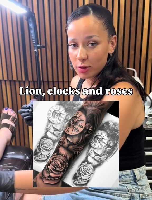 A woman holding up three tattoo designs featuring a lion, clocks, and roses.