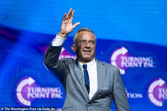 Robert F. Kennedy Jr. speaks with Republican presidential nominee former President Donald Trump at a Turning Point Action Rally in Duluth, GA on Wednesday, Oct. 23, 2024