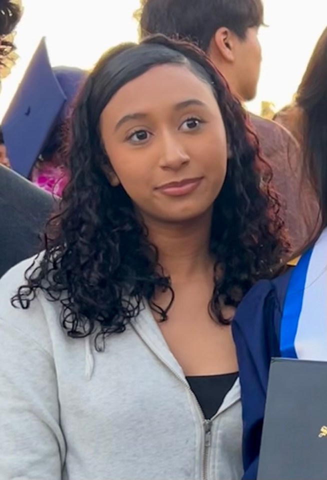Celeste Rivas, a young woman with dark curly hair, wearing a gray zipped hoodie and black top, and a person in a blue graduation gown next to her.