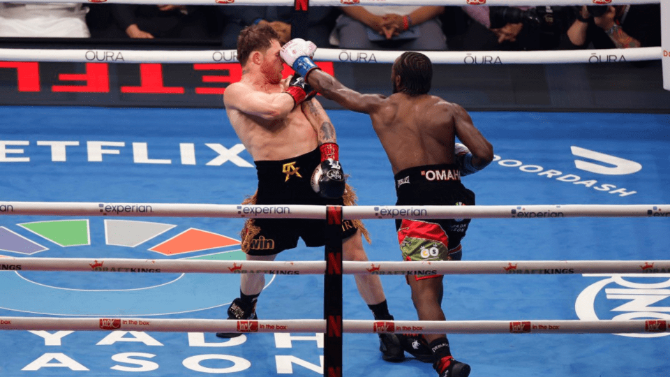 Two boxers fighting in a ring.