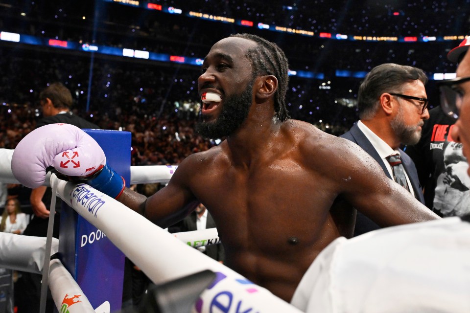 Terence Crawford celebrates after defeating Canelo Alvarez in a super middleweight championship boxing match.