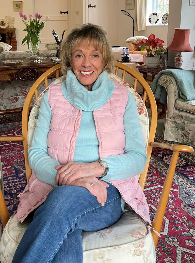 Woman sitting in a rocking chair.
