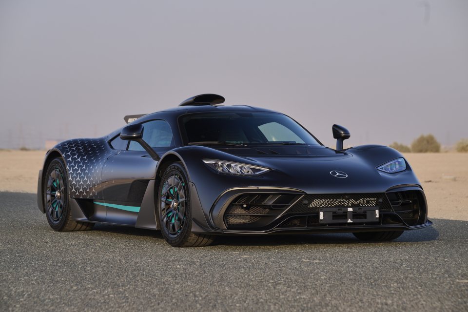 The 2024 Mercedes-Benz AMG ONE, F1-derived hybrid V6 hypercar in black with STAR Motorsport graphics and teal highlights.