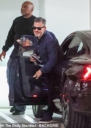 Kimmel put on a brave face and smiled for the cameras as he stepped out of the car