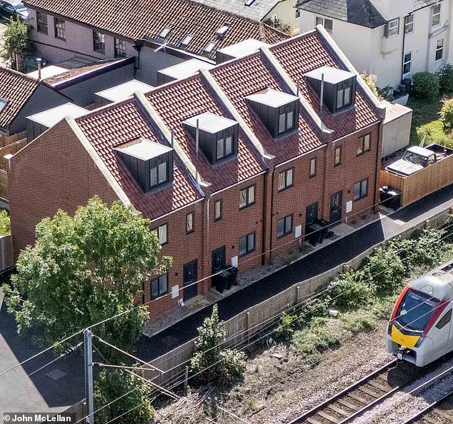 Residents in a sleepy Suffolk village say the decision to house legal migrants in four brand-new houses (pictured) has brought simmering tensions to the surface