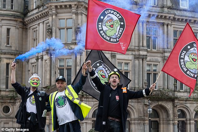 Workers raised smoke bombs, waved flags and chanted in support of Birmingham's striking bin workers
