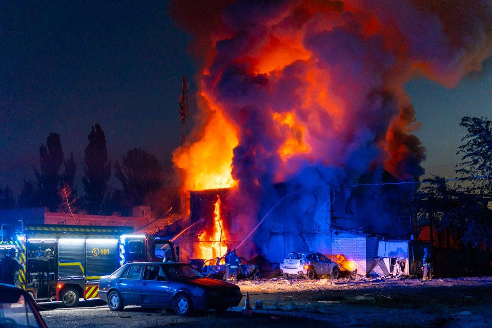 Firefighters working to put out a massive fire in a building in Zaporizhzhia, Ukraine.