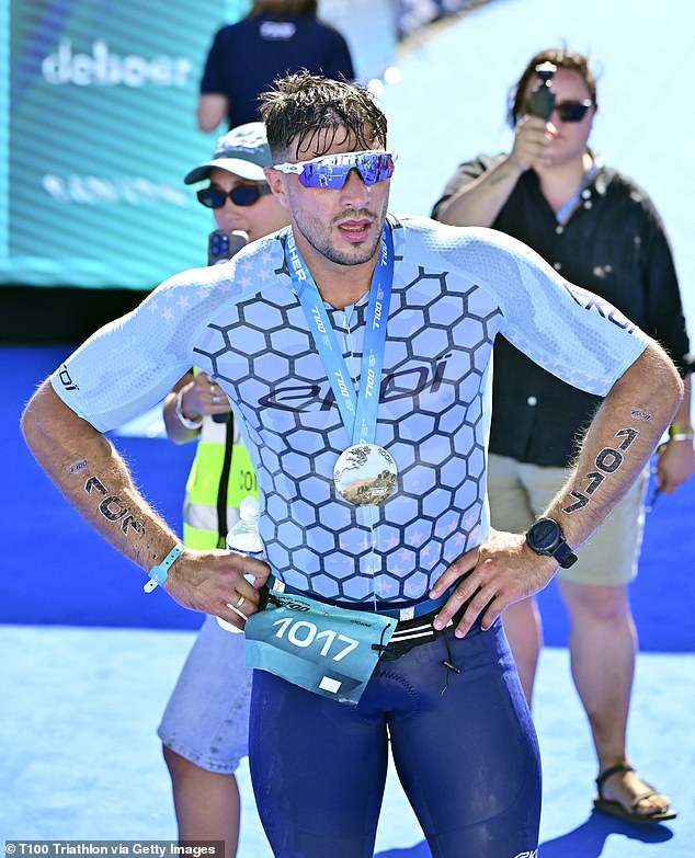 Data from the challenge showed the boxer seemingly 'did not finish' the gruelling challenge when he travelled to France to take part last week (pictured finishing the triathlon)
