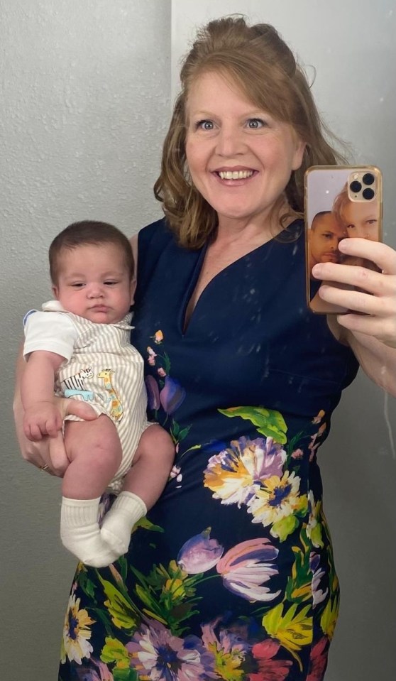 A woman holding her baby.