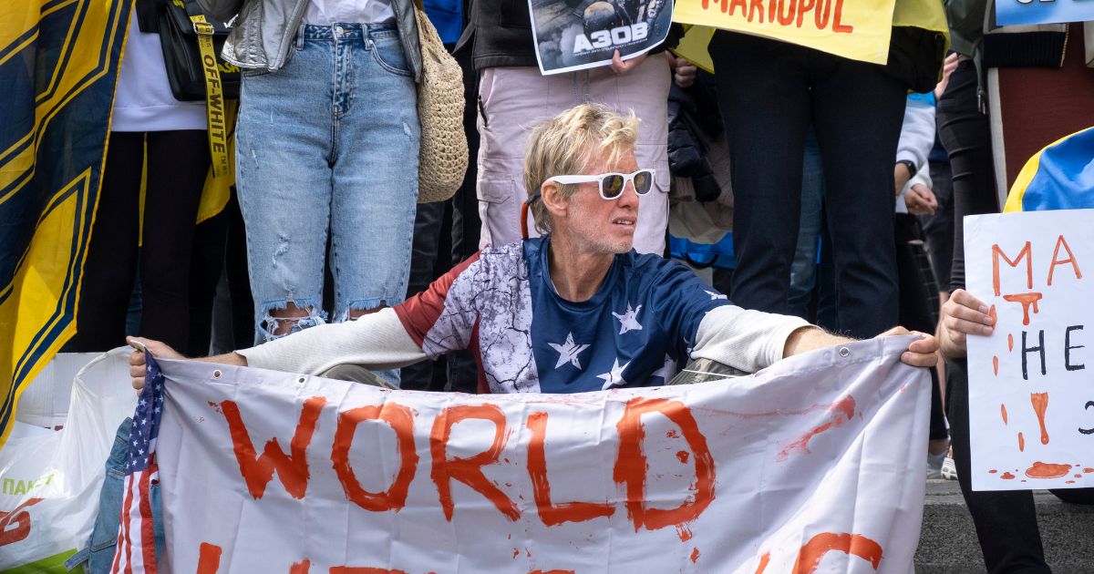 Ryan Routh holds a banner during a demonstration in support of Mariupol defenders on May 3, 2022, in Kyiv, Ukraine.