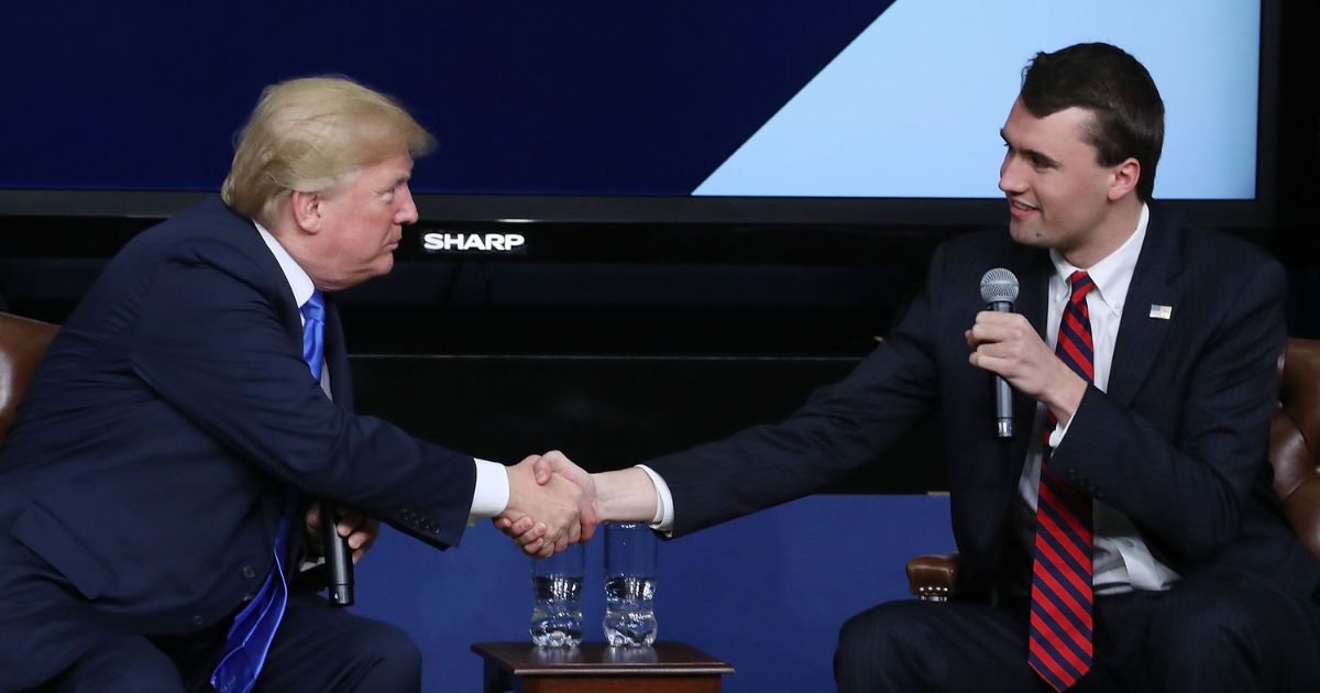 President Donald Trump shakes the hand of Charlie Kirk at the White House on March 22, 2018 in Washington, D.C.