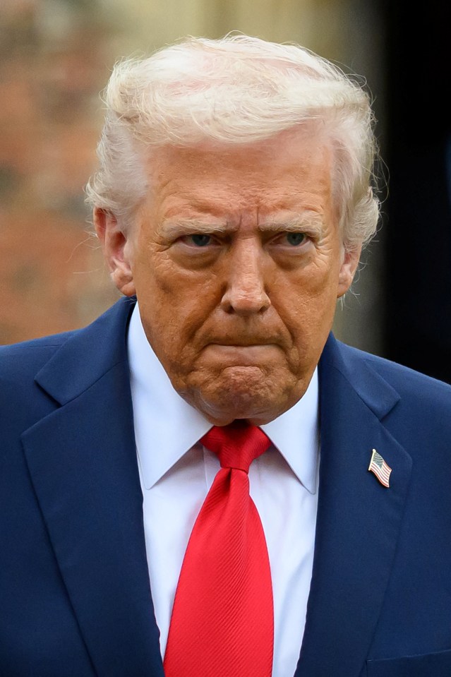 U.S. President Donald Trump in a blue suit and red tie.