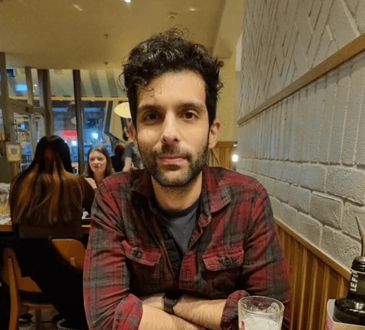 Modie Al-Shakarchi, 34, looking directly at the camera.