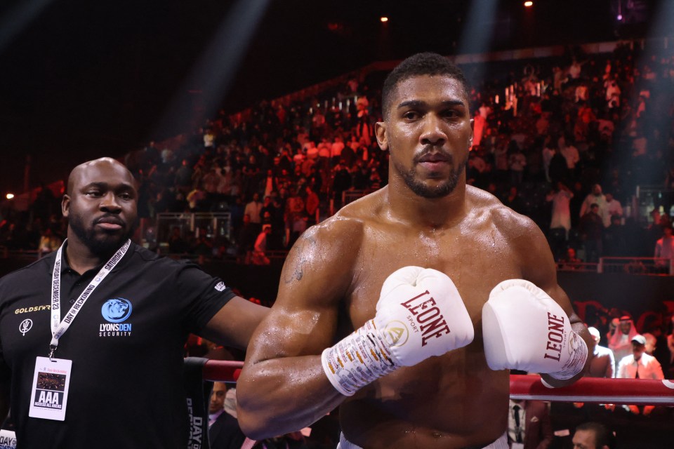 Anthony Joshua in boxing gloves after a heavyweight match.