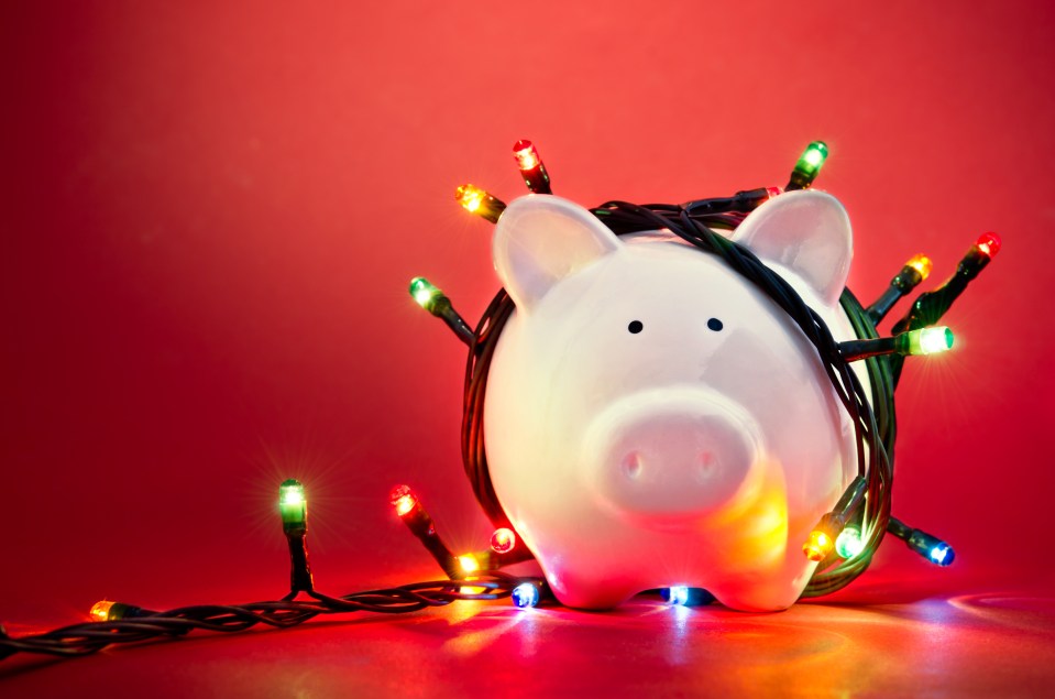 Piggy bank wrapped in Christmas lights.