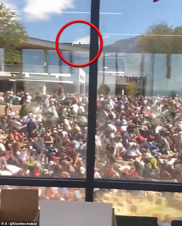 Another video shared to X, captured in the moments after the shooting from what appears to be from inside a campus building, pans across the room - and in a brief moment, an individual can be seen sprinting across the same rooftop (pictured)