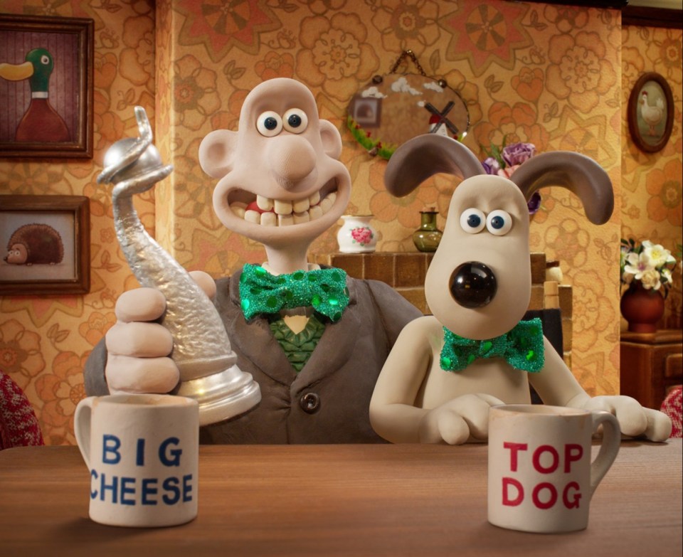 Wallace and Gromit with a television award.