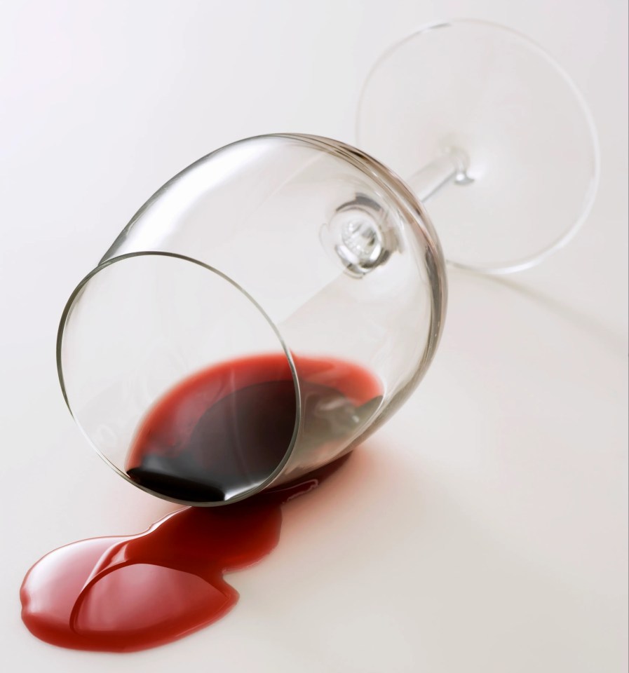 A spilled glass of red wine.