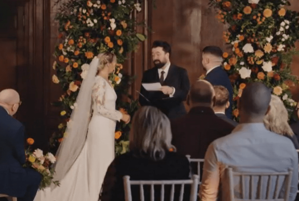 A wedding ceremony with a bride and groom standing before an officiant.