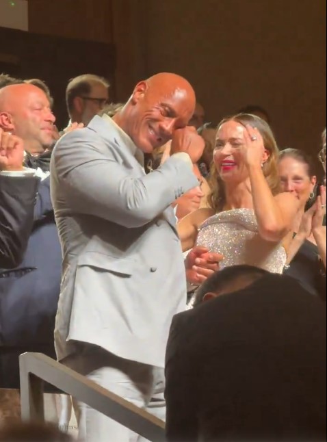 The Rock wiping away tears after his movie received a 15-minute standing ovation.