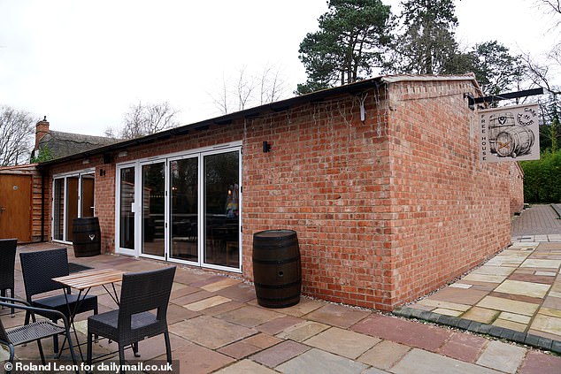A wealthy businessman has been ordered to tear down his Indian gastropub (pictured) after it was built just a stone's throw from Shakespeare's wife's childhood home