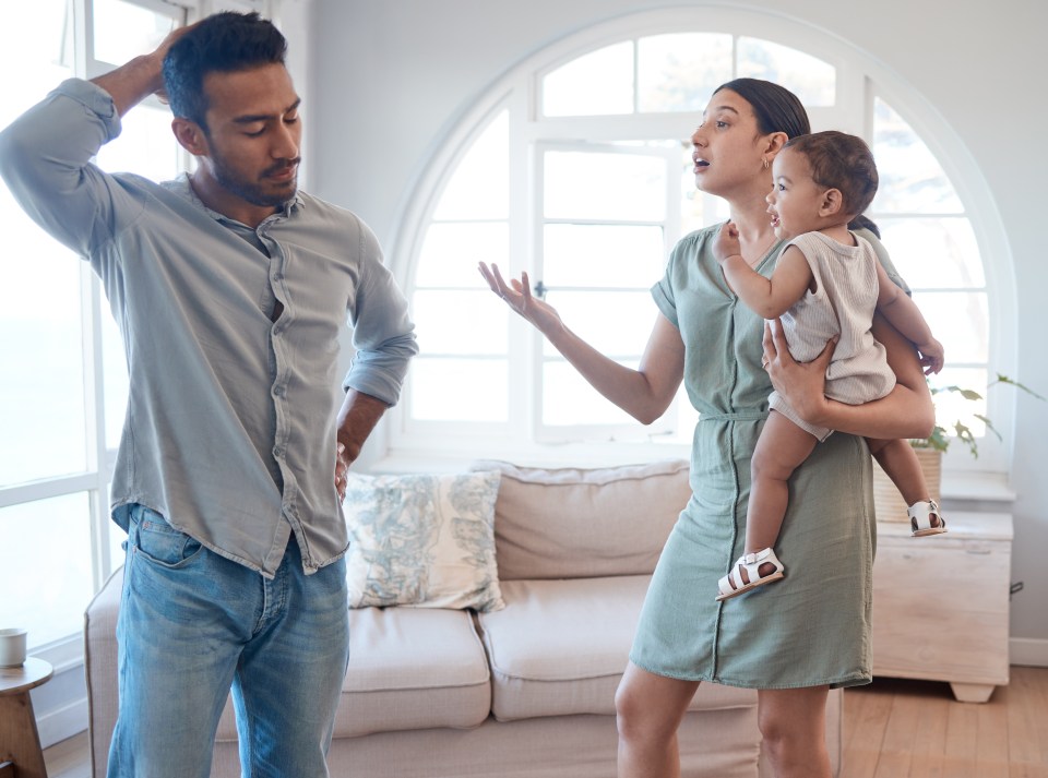 A couple argues in front of their baby.