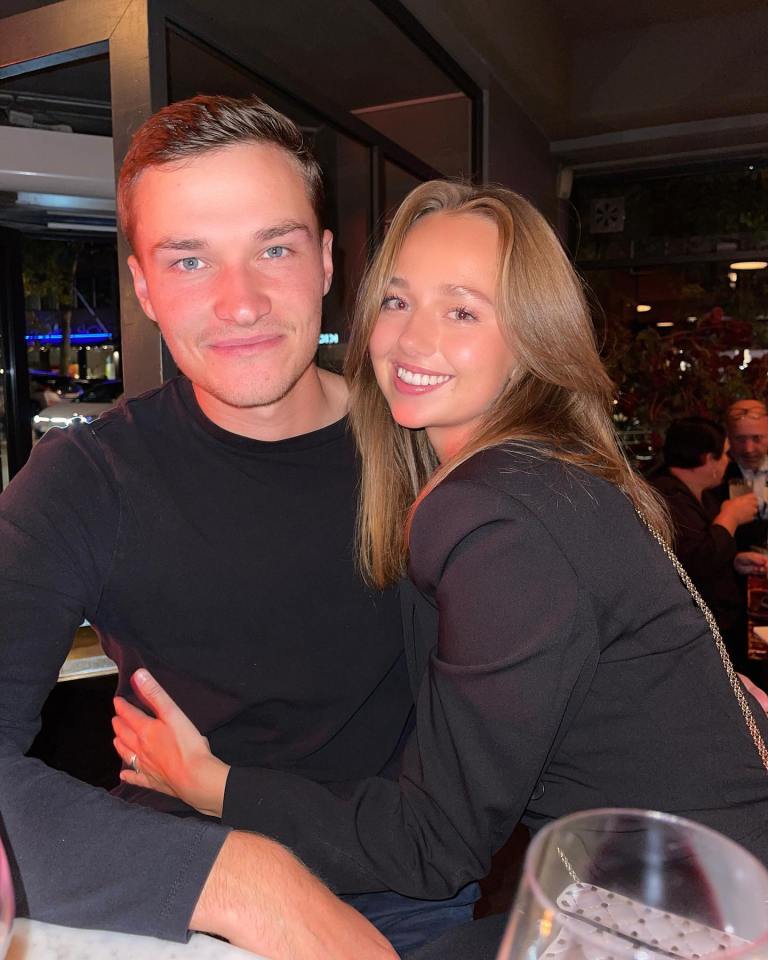 Julie Sander Danielsen and Rasmus Hojgaard smiling.