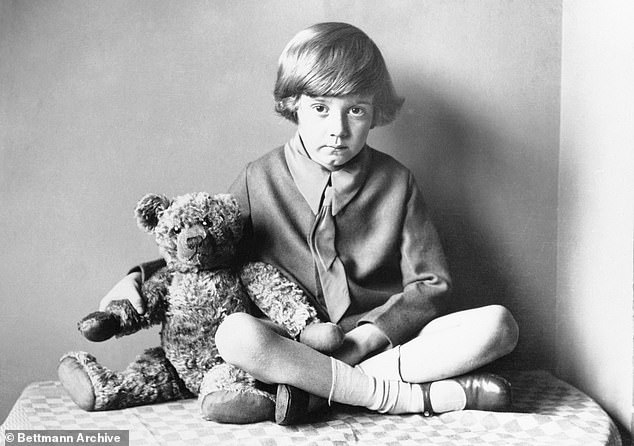 Christopher (pictured with his teddy bear Winnie the Pooh) loved the stories his father wrote