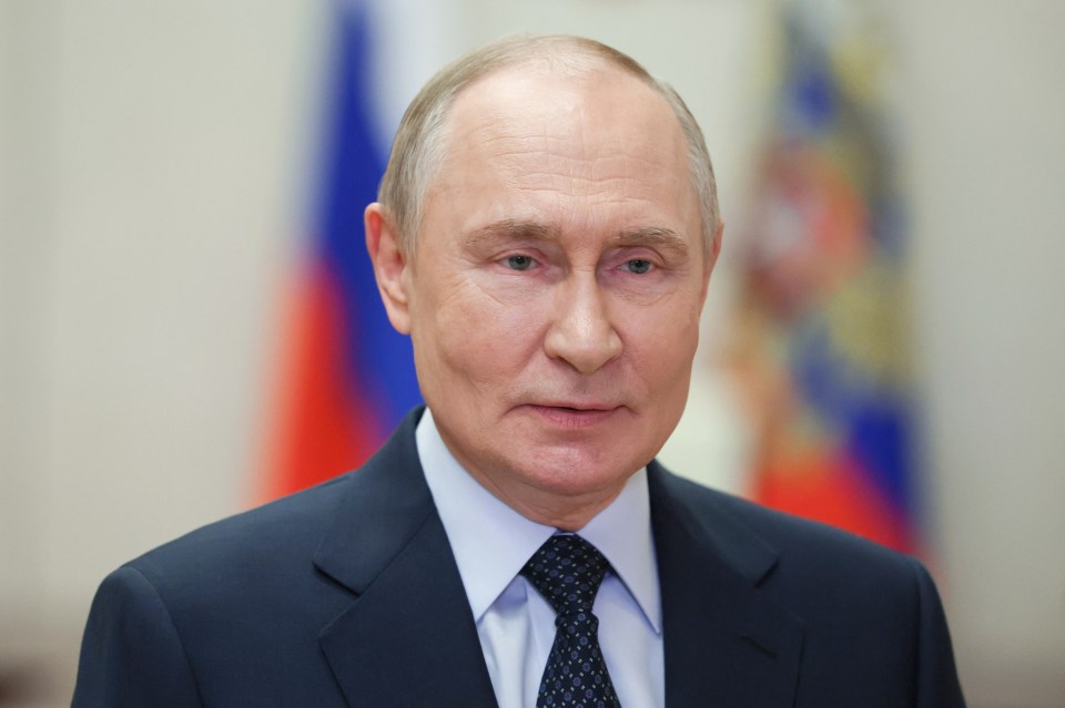 Russian President Vladimir Putin in a suit and tie, addressing contestants of the Intervision Song Contest via video link.