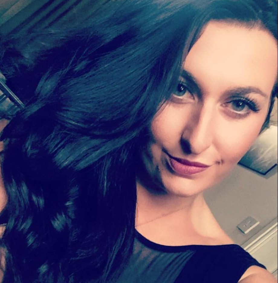 Jenny Keepe with dark hair and wearing a black top.