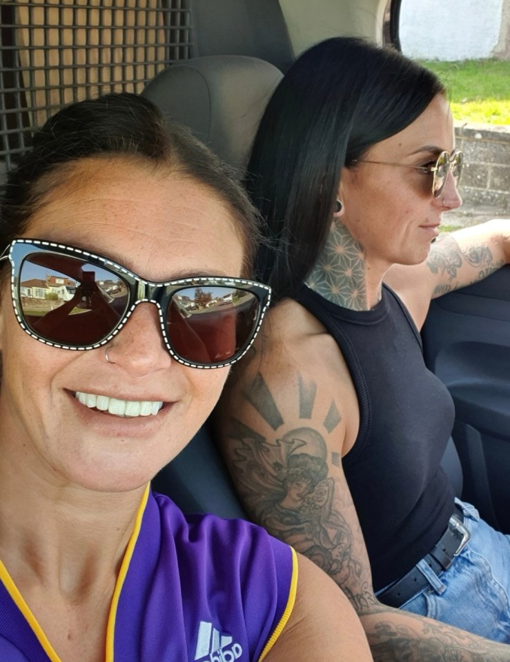 Two women sitting in a car.