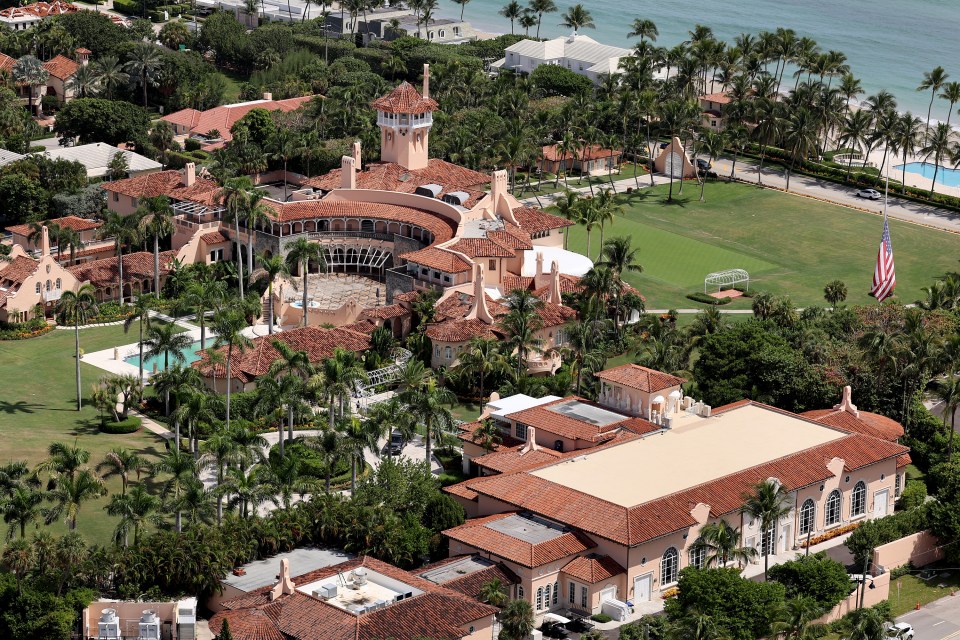 Aerial view of Donald Trump's Mar-a-Lago estate in Palm Beach, Florida, with the ocean in the background.