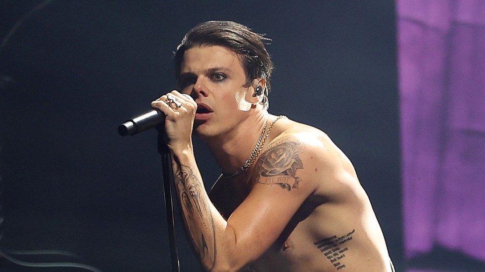 Yungblud performing on stage.