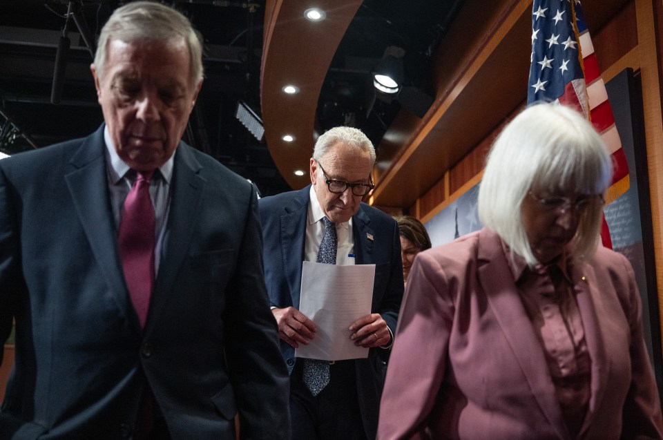 US Senate Minority Leader Chuck Schumer (C) leaves a press conference with Senators Dick Durbin (L) and Patty Murray (R) on Capitol Hill.