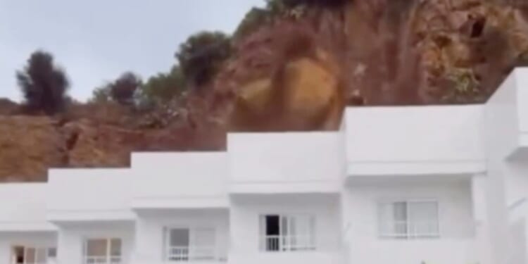 Watch moment rocks COLLAPSE on Ibiza hotel in front of screaming tourists as Spanish island is battered by mega storm