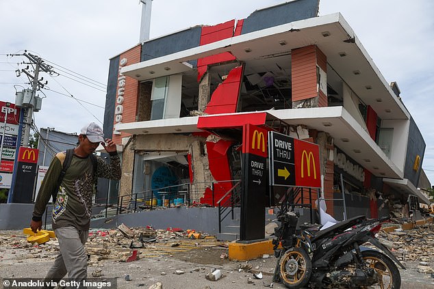 A McDonald's restaurant is destroyed after the earthquake. Several businesses were damaged in the aftermath