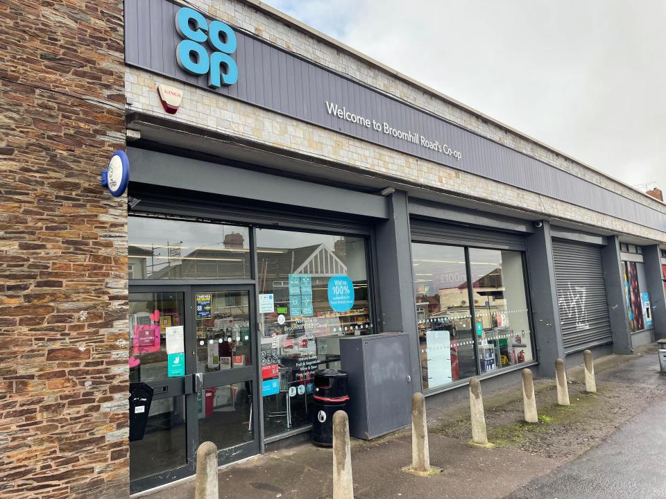Exterior of a Co-op convenience store with a brick facade and a sign welcoming customers to Broomhill Road's Co-op.