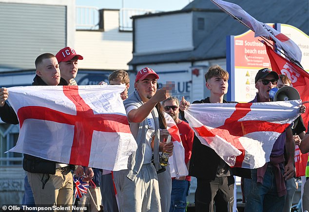 Anti-migrant activists are seen facing off against protests from Stand Up to Racism in Southsea on August 1