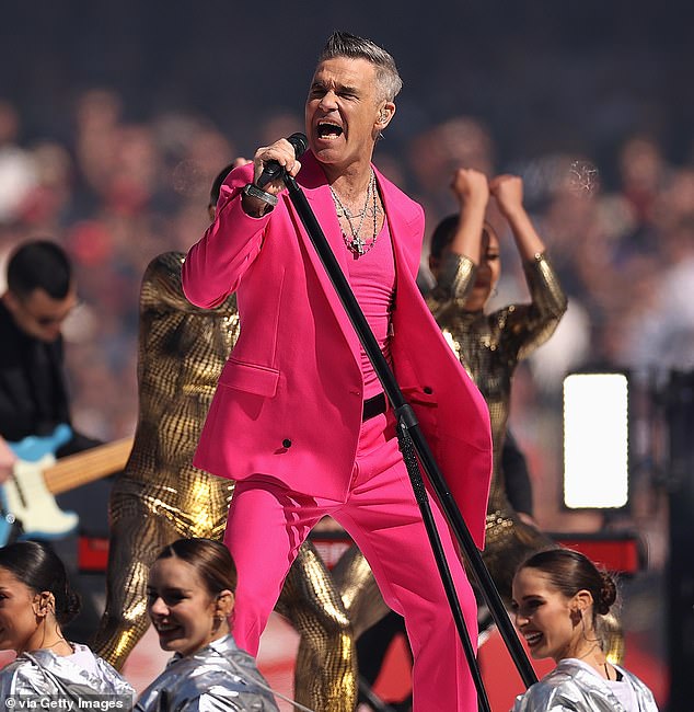 Robbie says his mental health has also deeply affected his touring and playing live - and admits he still struggles to cope with the demands of life on the road (pictured September 2022)