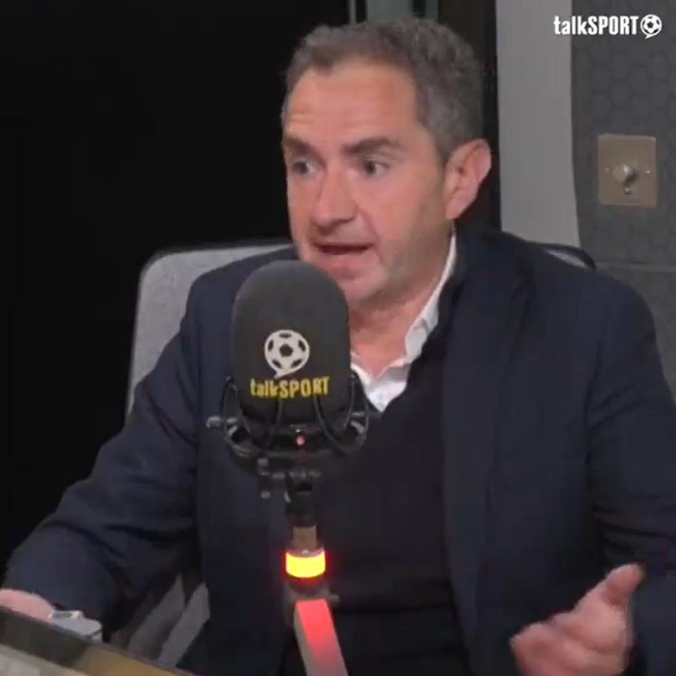 Stefan Borson speaking into a Talksport microphone.
