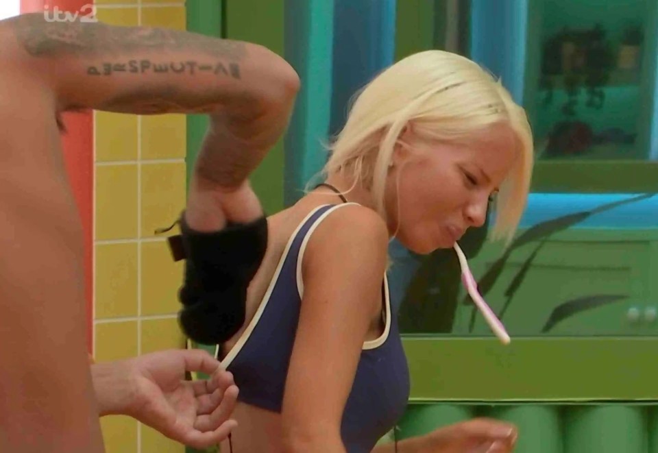 Marcus scrubs a spot on Elsa's back.