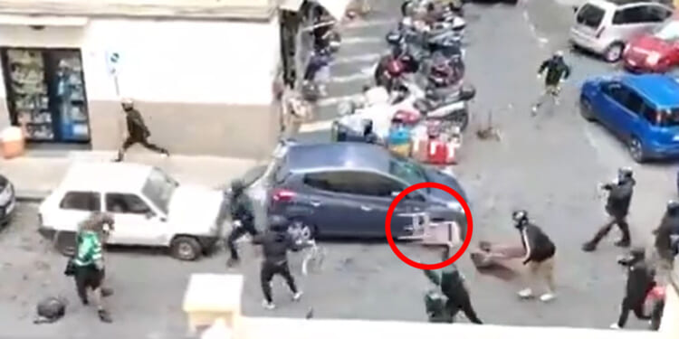 Shocking moment football fans throw CHAIRS as huge street brawl breaks out before Champions League clash