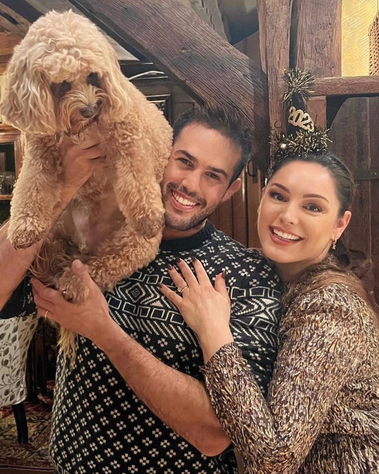 Kelly Brook with Jeremy Parisi holding their dog Teddy.