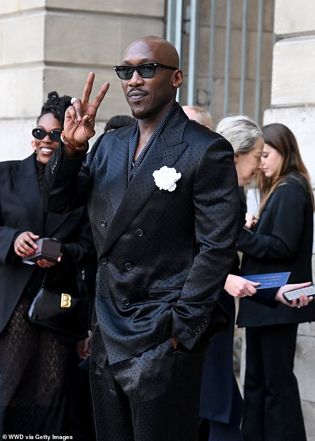 Oscar-winning actor Mahershala Ali cut a dapper figure in a silky black suit with a spotted print
